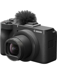 Cámara Canon PowerShot V1 en ángulo, lente zoom y micrófono visible, diseño compacto ideal para vlogs