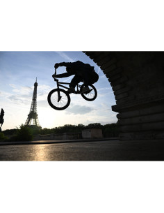 A cyclist performing a trick against the silhouette of the Eiffel Tower, captured with Nikon NIKKOR Z 24-70mm f/2.8 S II Lens A cyclist performing a trick against the silhouette of the Eiffel Tower, captured with Nikon NIKKOR Z 24-70mm f/2.8 S II Lens