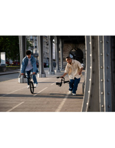 Two men engaging in an outdoor activity, one riding a bicycle and the o, captured with Nikon NIKKOR Z 24-70mm f/2.8 S II Lens Two men engaging in an outdoor activity, one riding a bicycle and the o, captured with Nikon NIKKOR Z 24-70mm f/2.8 S II Lens