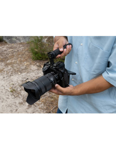 A person holding a camera with a lens in a natural outdoor setting, captured with Nikon NIKKOR Z 24-70mm f/2.8 S II Lens A person holding a camera with a lens in a natural outdoor setting, captured with Nikon NIKKOR Z 24-70mm f/2.8 S II Lens