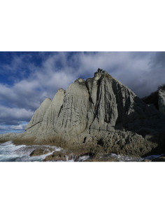 Rocky cliff with textured surface against a dramatic sky, captured with Sony FE 16mm f/1.8 G Rocky cliff with textured surface against a dramatic sky, captured with Sony FE 16mm f/1.8 G