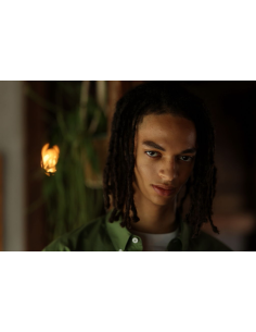 Young man with dreadlocks in a softly lit room with plants in the background, captured with Canon RF 85mm f/1.4 L VCM Lens Young man with dreadlocks in a softly lit room with plants in the background, captured with Canon RF 85mm f/1.4 L VCM Lens