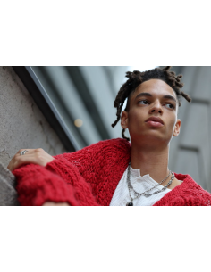 Young person in a red sweater looking contemplatively outside, soft light creat, captured with Canon RF 85mm f/1.4 L VCM Lens Young person in a red sweater looking contemplatively outside, soft light creat, captured with Canon RF 85mm f/1.4 L VCM Lens