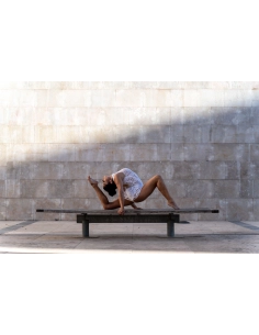 A dancer gracefully poses on a bench, showcasing flexibilit, captured with Tamron 35-150mm f/2-2.8 Di III VXD Lens for Nikon A dancer gracefully poses on a bench, showcasing flexibilit, captured with Tamron 35-150mm f/2-2.8 Di III VXD Lens for Nikon