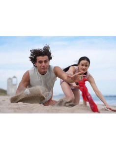Two people playing on the beach, one digging in sand, the other, captured with Sony Alpha 7 V – Full Frame Mirrorless Camera Two people playing on the beach, one digging in sand, the other, captured with Sony Alpha 7 V – Full Frame Mirrorless Camera
