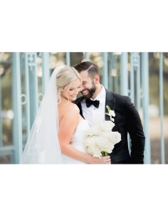 A joyous couple celebrating their wedding with a beautiful bouquet, captured with Canon RF 135mm f/1.8 L IS USM A joyous couple celebrating their wedding with a beautiful bouquet, captured with Canon RF 135mm f/1.8 L IS USM