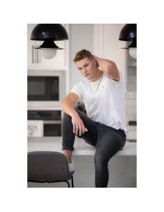 Young man sitting on a kitchen countertop, relaxed pose, modern kitchen setting, captured with Canon RF 135mm f/1.8 L IS USM Young man sitting on a kitchen countertop, relaxed pose, modern kitchen setting, captured with Canon RF 135mm f/1.8 L IS USM