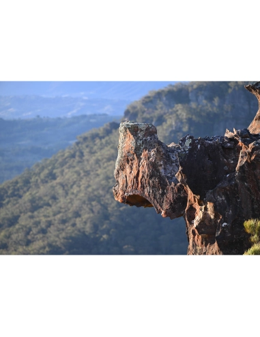 A rocky outcrop against a mountainous landscape, captured with Nikon Z 70-200mm f/2.8 VR S II