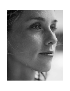 Close-up of a woman's face with water droplets, thoughtful expression, captured with Nikon Z 70-200mm f/2.8 VR S II Close-up of a woman's face with water droplets, thoughtful expression, captured with Nikon Z 70-200mm f/2.8 VR S II