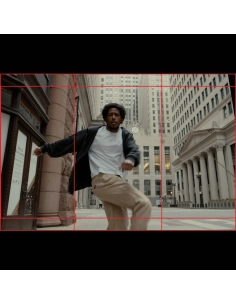 A man dancing in an urban setting with tall buildings around him, captured with Canon EOS R6 V Camera Body A man dancing in an urban setting with tall buildings around him, captured with Canon EOS R6 V Camera Body