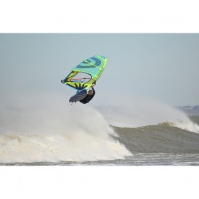 A windsurfer performing an aerial maneuver over ocean waves, captured with Nikon Z 400mm f/4.5 VR S A windsurfer performing an aerial maneuver over ocean waves, captured with Nikon Z 400mm f/4.5 VR S