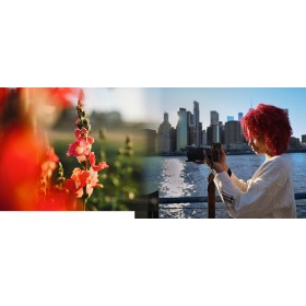 Persona con cabello rizado rojo fotografiando un paisaje urbano con flores rojas al frente, capturado con Nikon Z 35mm f/1.4 Persona con cabello rizado rojo fotografiando un paisaje urbano con flores rojas al frente, capturado con Nikon Z 35mm f/1.4