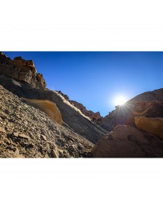 A person biking down a rocky slope under a clear blue sky with the sun shining b, captured with Canon RF 16-28mm f/2.8 IS STM A person biking down a rocky slope under a clear blue sky with the sun shining b, captured with Canon RF 16-28mm f/2.8 IS STM
