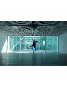 A person striking a joyful pose in a modern, spacious room with large windows, captured with Canon RF 16-28mm f/2.8 IS STM A person striking a joyful pose in a modern, spacious room with large windows, captured with Canon RF 16-28mm f/2.8 IS STM