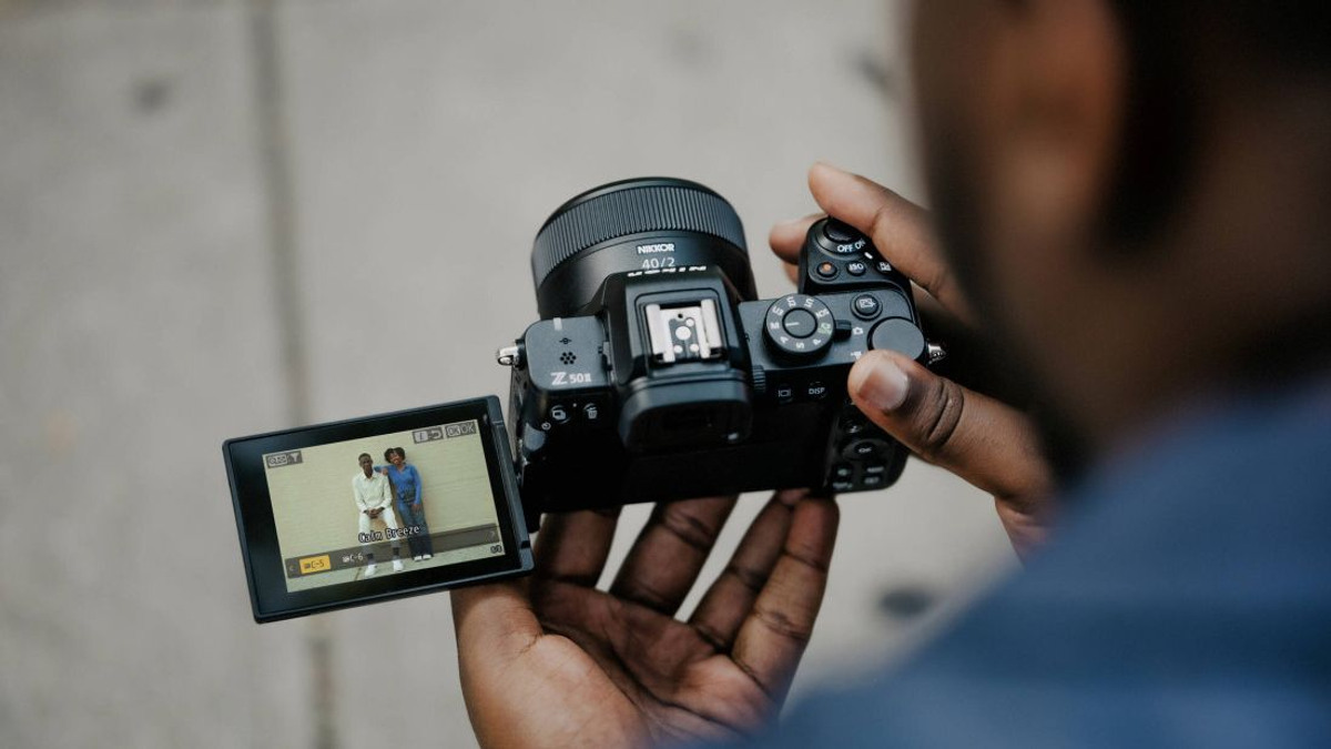 Creator framing video with a real Nikon Z50II and its vari-angle screen