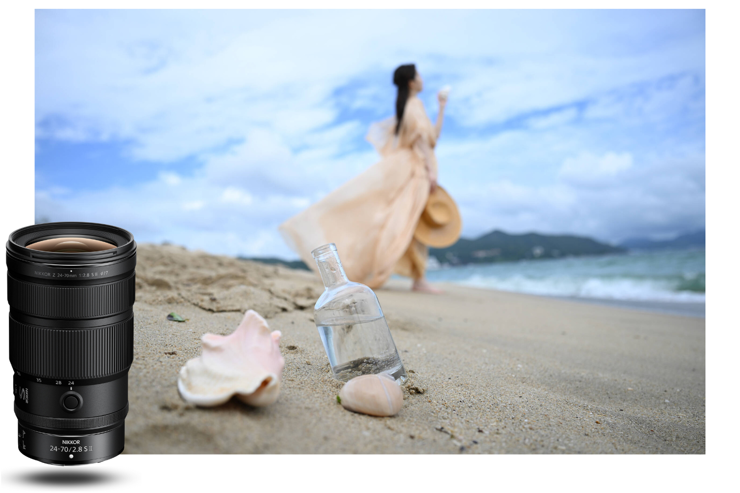 Nikon NIKKOR Z 24-70mm f/2.8 S II lens on a beach, focused on a bottle and seashell in foreground